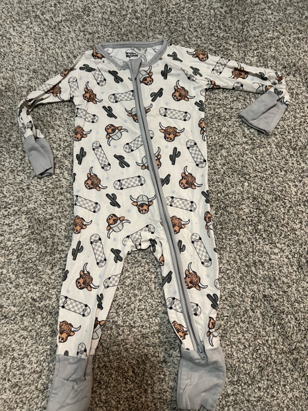 Dream big little co - Gray Western Cow w/ skateboard print Footed sleeper